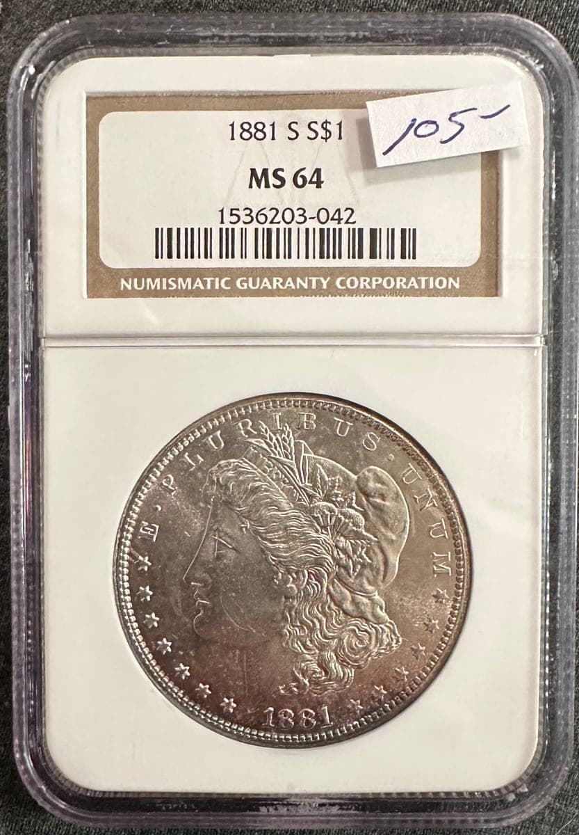 Phone photo of a Morgan dollar in an NGC holder